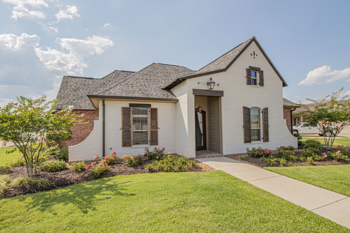 Traditional brick home with landscaping